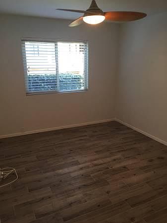 Bedroom: Brand new floors, paint, and ceiling fan.