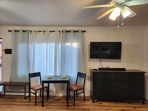 Dining for 2, dresser, and smart TV