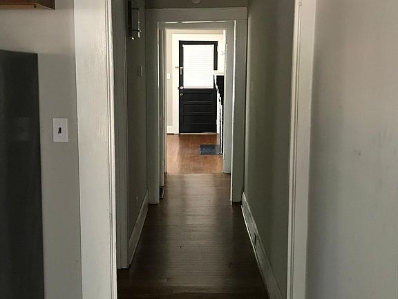 Hallway from kitchen looking towards front door