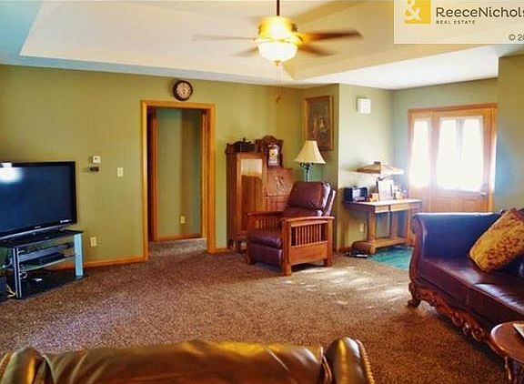 Living room has vault in ceiling and new fixtures, tile entry, and nice side panel door.