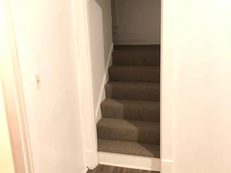 Stairs off the den/dining room