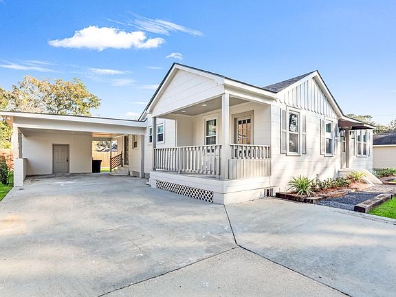 Side porch, covered parking and storage room