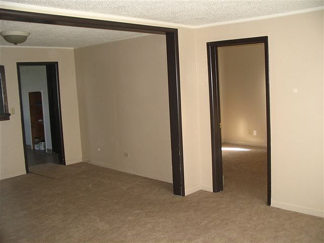 view of one bedroom, living and dining area