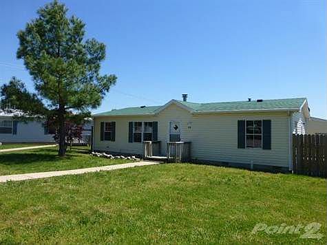 This 1999 built home is located in a subdivision directly next to Hollister, MO High School and baseball field.