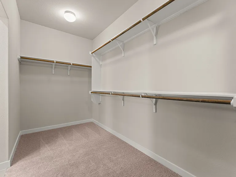Large walk-in closet for the master bedroom.