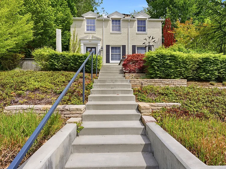 Front walkway from the street. There is also a covered private tunnel from the 2 garages directly to the lower level of the house.
