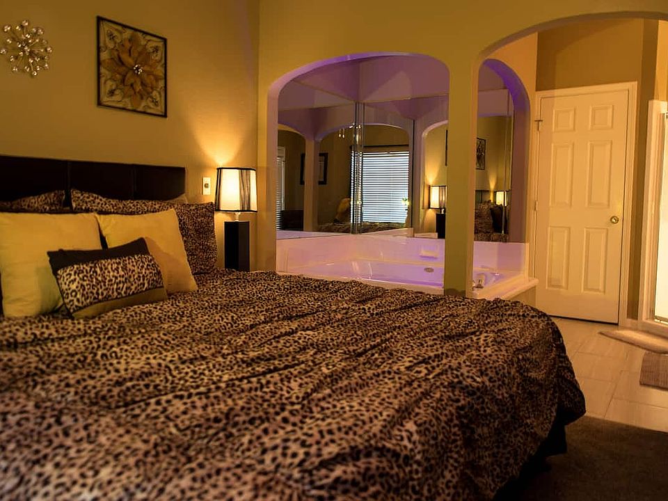 master bedroom with king size bed and jacuzzi tub, walk in shower also