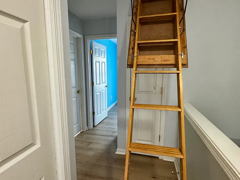 Attic access providing additional storage space