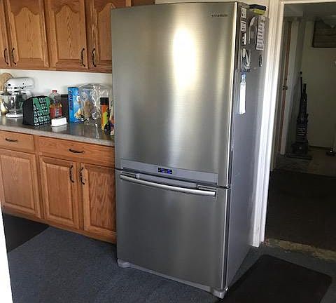 Big refrigerator and extra freezer in basement