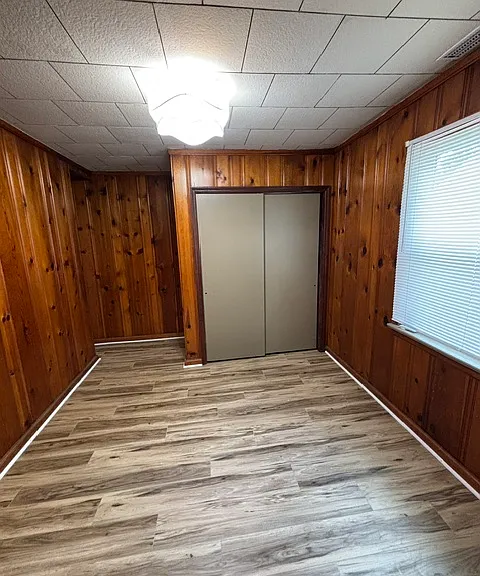 Bedroom 3. Located behind garage workshop area, with kitchen on the other side.