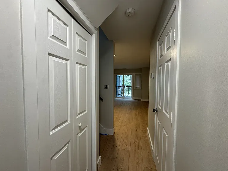 Ample closet space and a half bath are right off the kitchen.