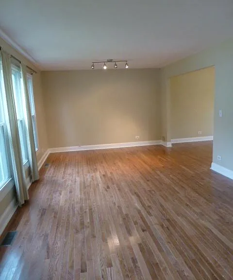 Living room which opens to dining room and kitchen