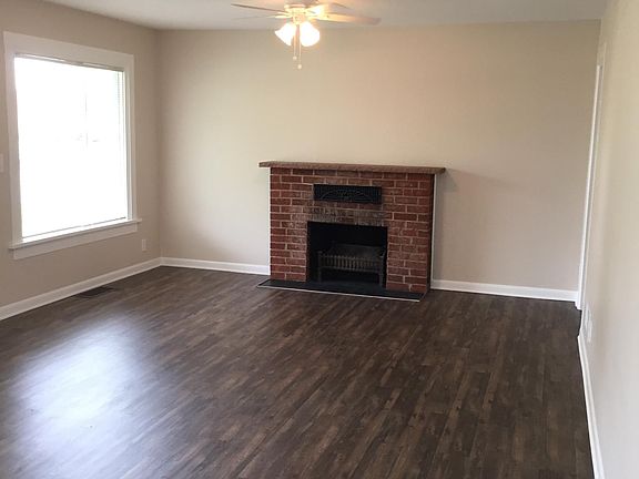 Original wood fireplace adds to the charm of this home.