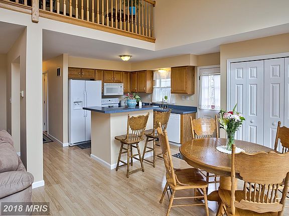 Alternate view of dining area and  kitchen