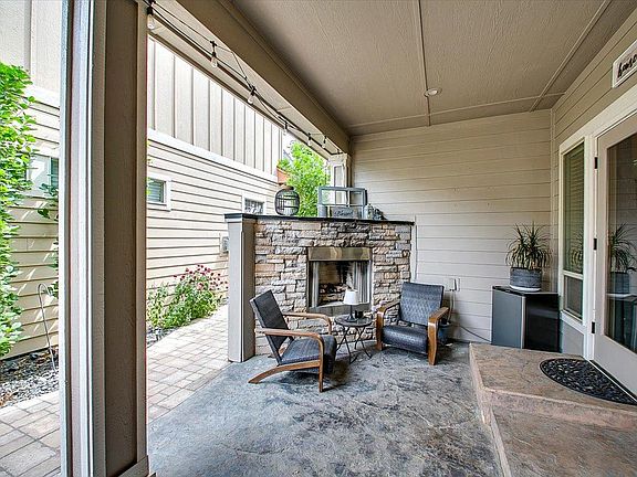 Patio accessible from living room - Gas fireplace with seating