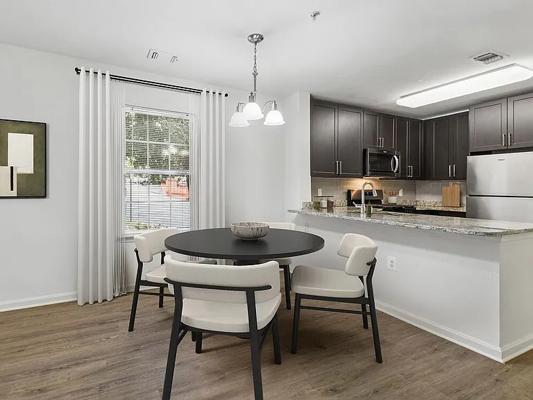 Renovated Package I kitchen and dining area with hard surface flooring
