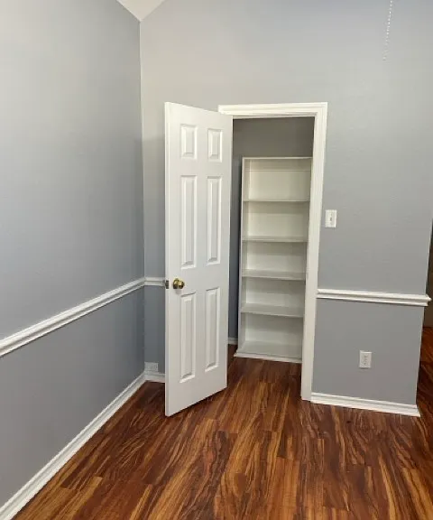 1st bedroom closet with built in shelving.