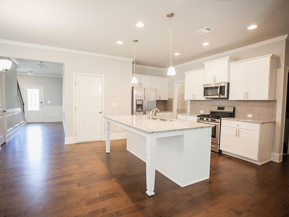 big open kitchen with stainless steel appliances