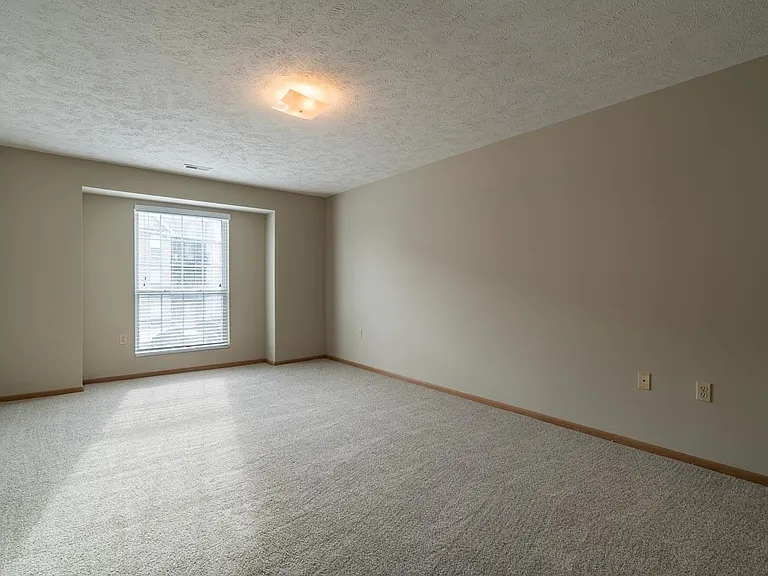 A cozy layout and bright windows offer a comfortable spot to unwind or start the day with a little natural light.