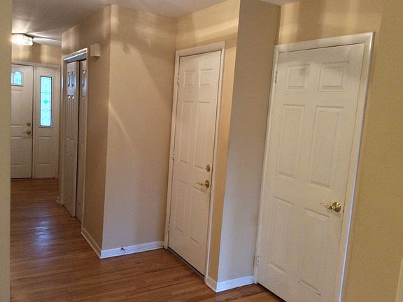front hallway, basement door, garage door, double closet
