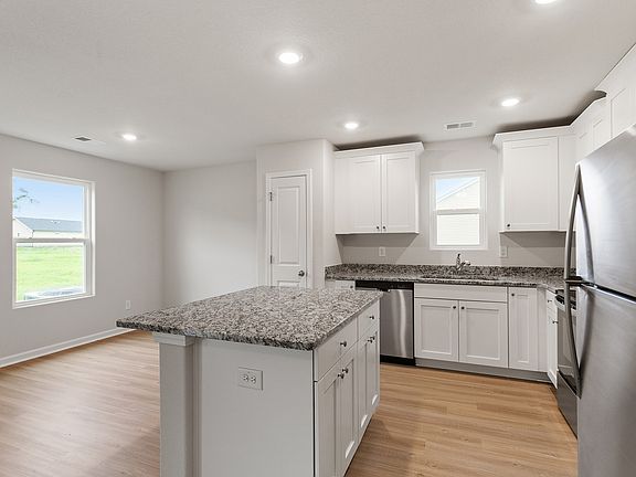 The kitchen has stainless steel appliances