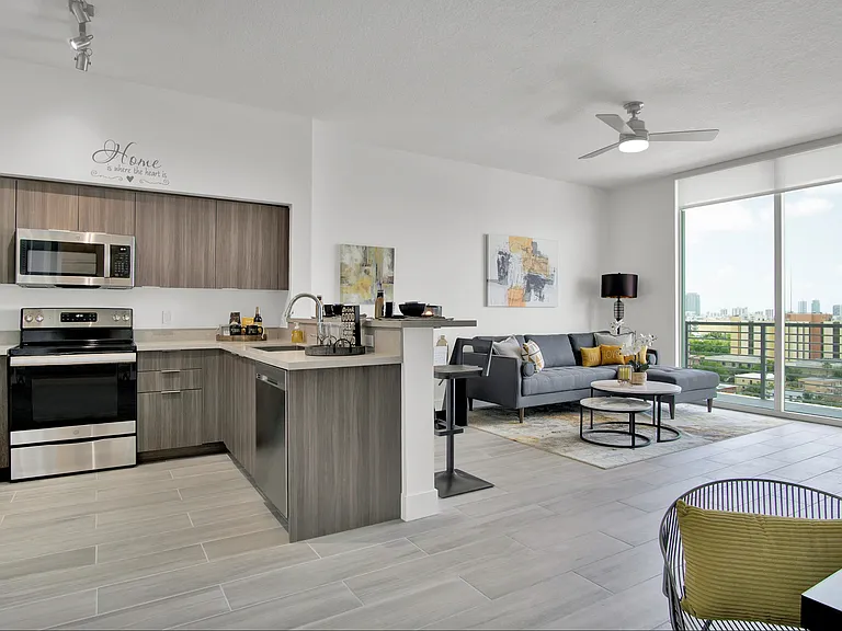 1 Bedroom - Model Unit | Large Bathrooms with Shower Glass Enclosures | Italian Kitchens Complete with Breakfast Bar, Walnut Cabinetry, and Stainless Steel Appliances
