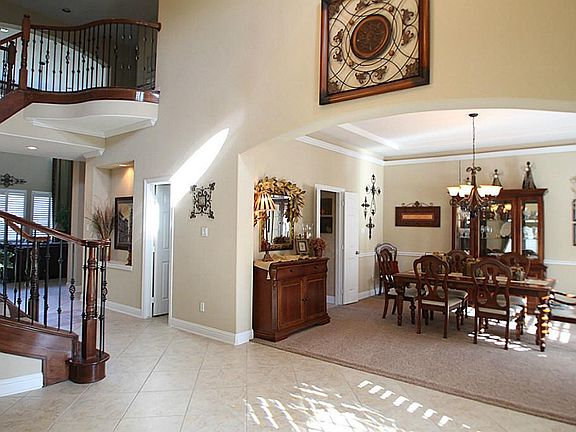 Entrance and formal dining room with crown molding.