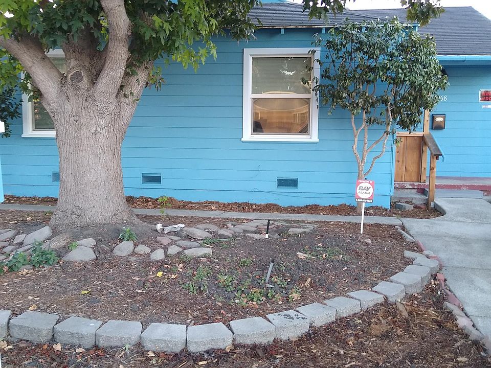 Front house seen from sidewalk.