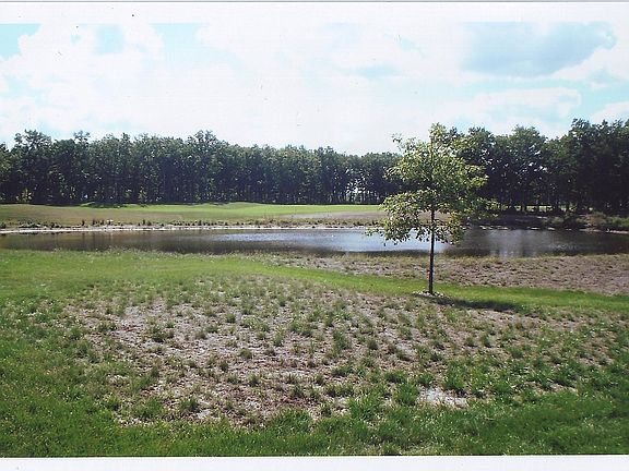 View from sunroom of pond and golf