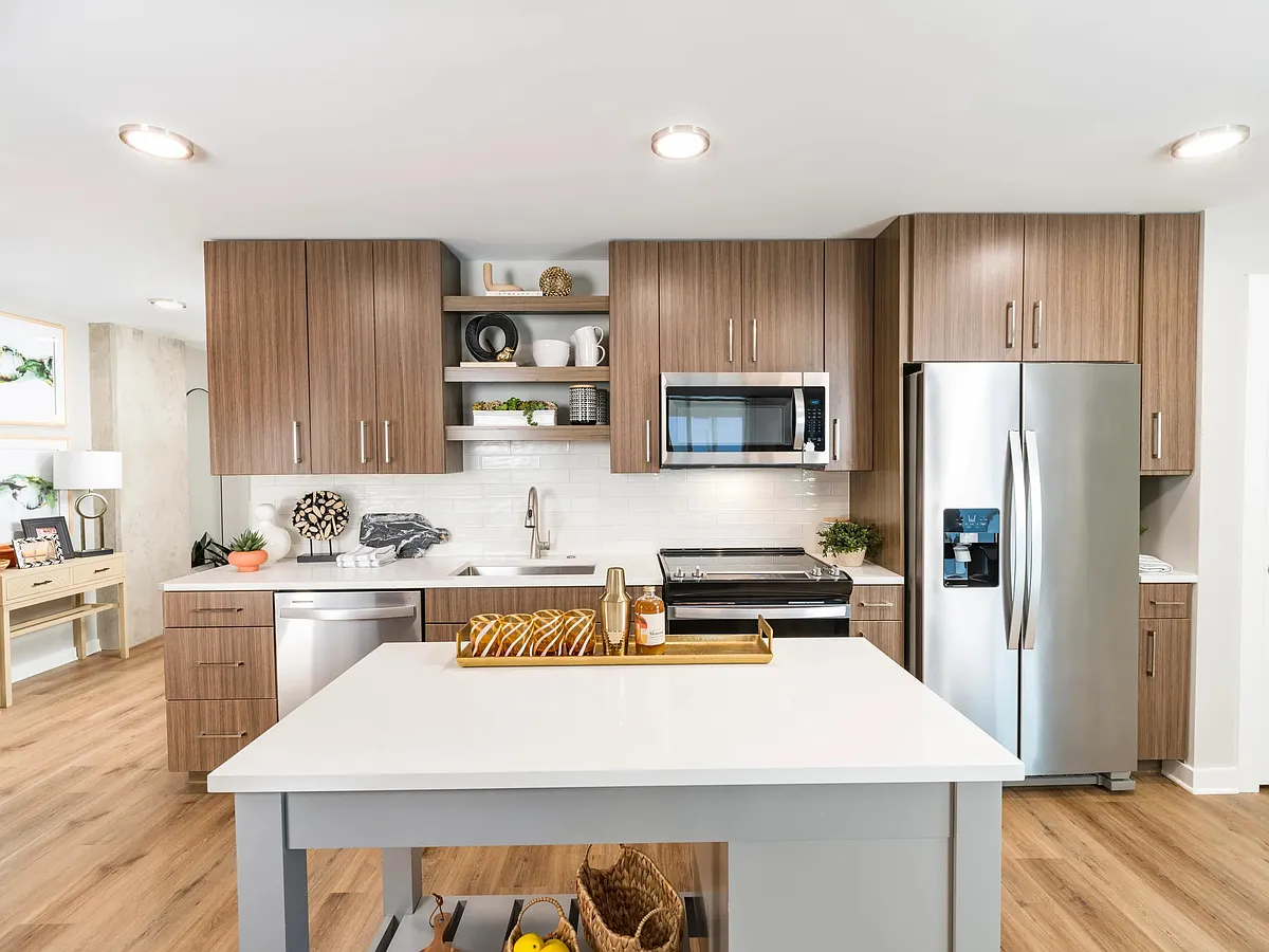Custom cabinetry and quartz counters in a true chef's kitchen. - Modera LoSo