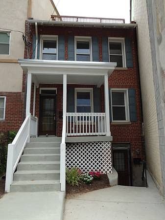 Front of townhouse with front porch.