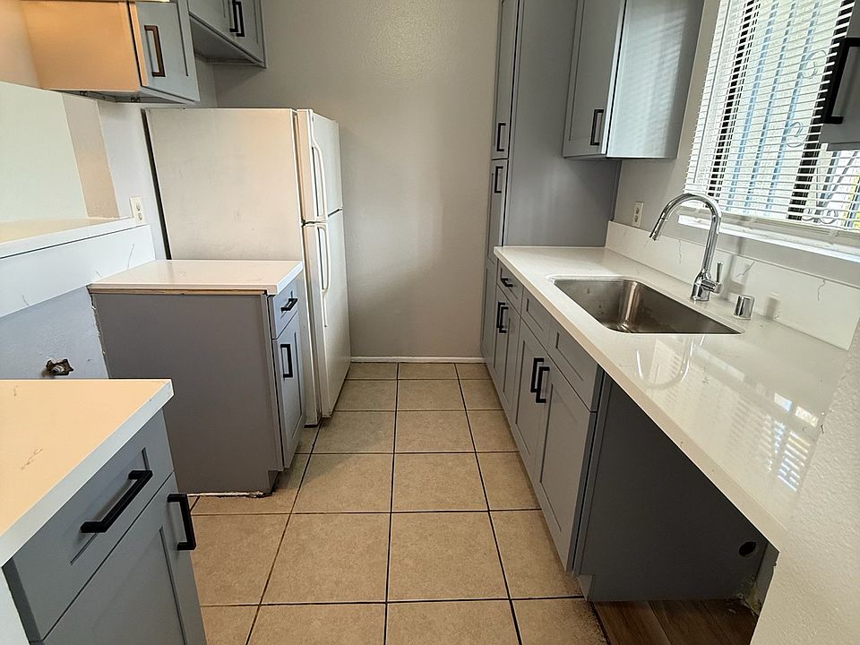 Fully renovated kitchen with bright, natural light (new dishwasher and stove not pictured but will be installed prior to move-in)