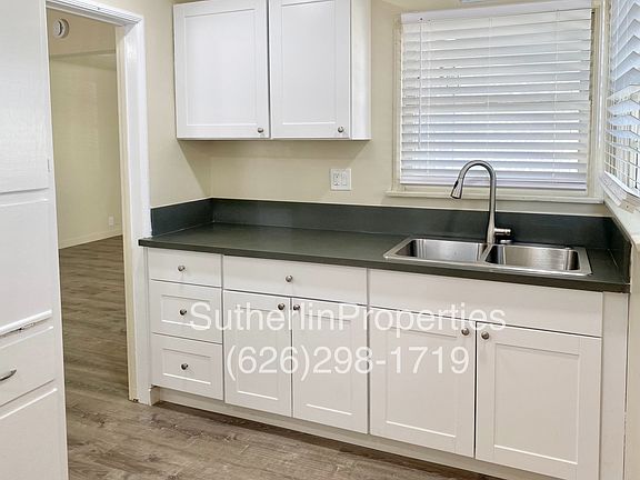Kitchen with new cabinets, quartz countertops, double stailess-steel sink with drop down faucet