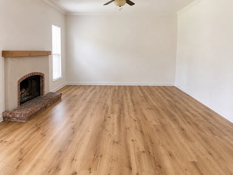Living room with fireplace and engineered wood flooring