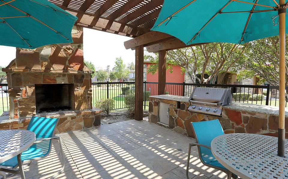 Inviting poolside retreat with shaded areas and outdoor relaxation space.