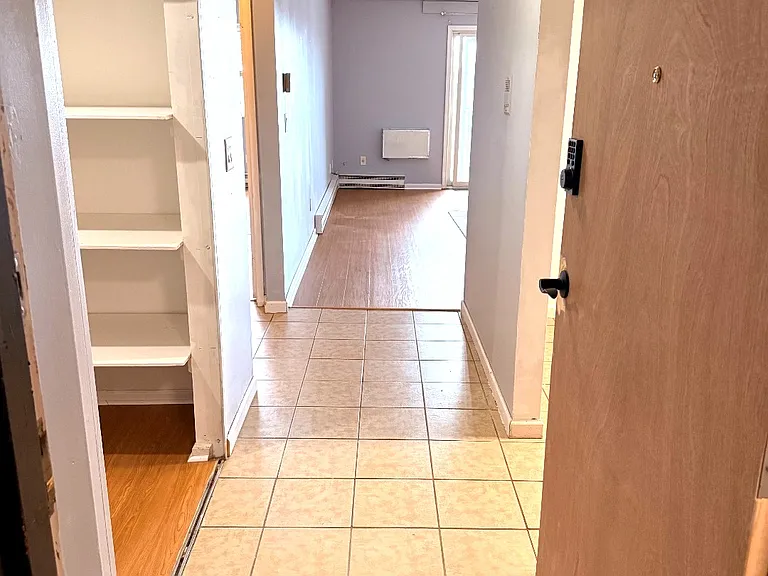 Entry area with tile flooring and direct access to the main living space