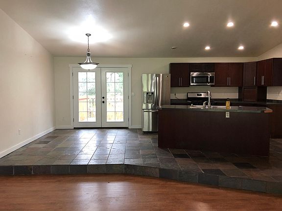 Main Floor LR/DR/Kitchen with French doors leading to upper 