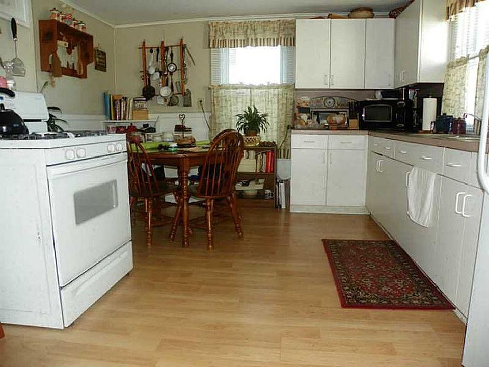 Kitchen with wood floor, gas stove