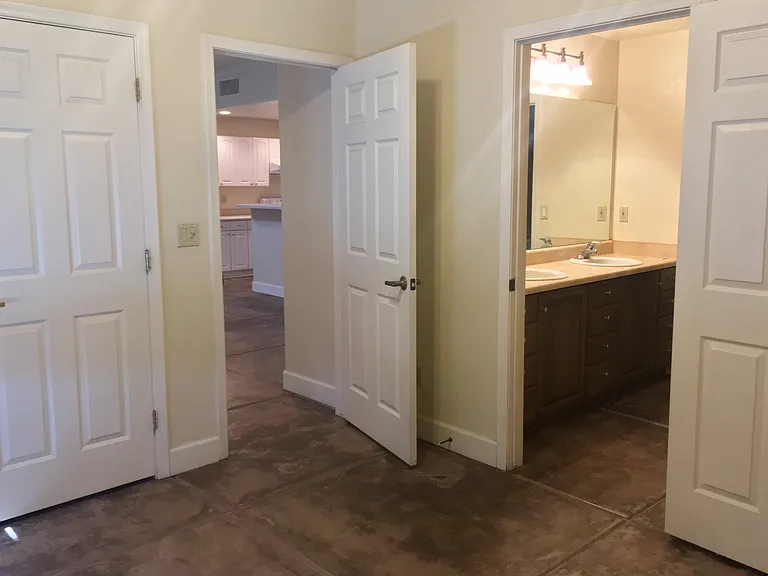 Bedroom looking to great room and bathroom
