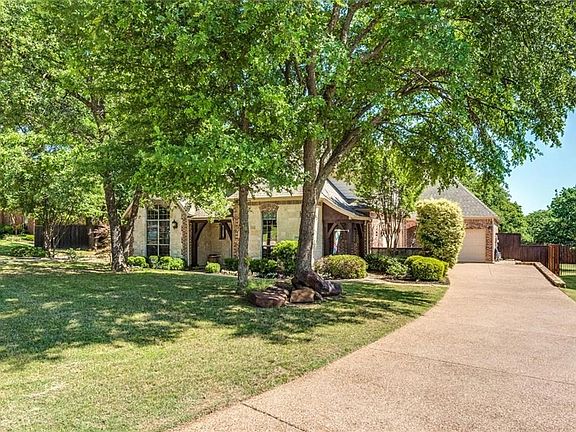 3 car garage with a 2 car swing side entry & a 1 car front entry plus aggregate driveway.