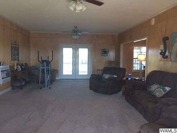 GREAT ROOM IS THE HOLE WIDTH OF THE HOUSE WITH DOUBLE DOOR GOING ONTO THE COVER DECK