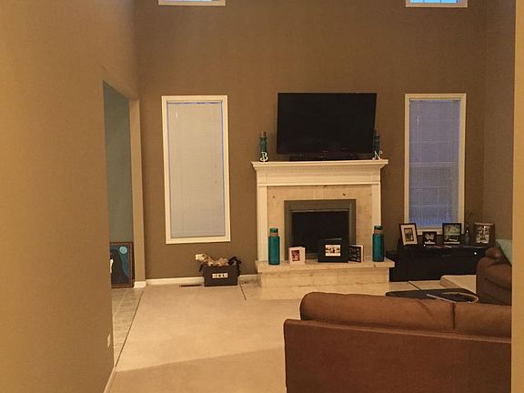 living room, 18ft ceiling, sky lights multiple windows
