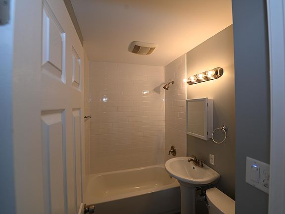 BATHROOM - Fresh and New!! Full Sized Tub surrounded with Subway Tiles!