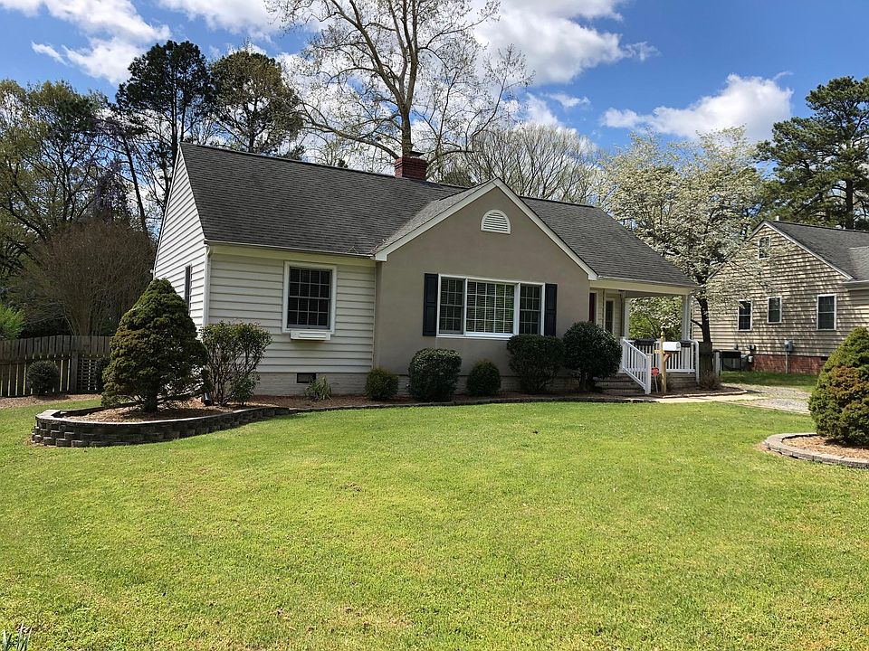 Front of house. Entry is under the covered porch.