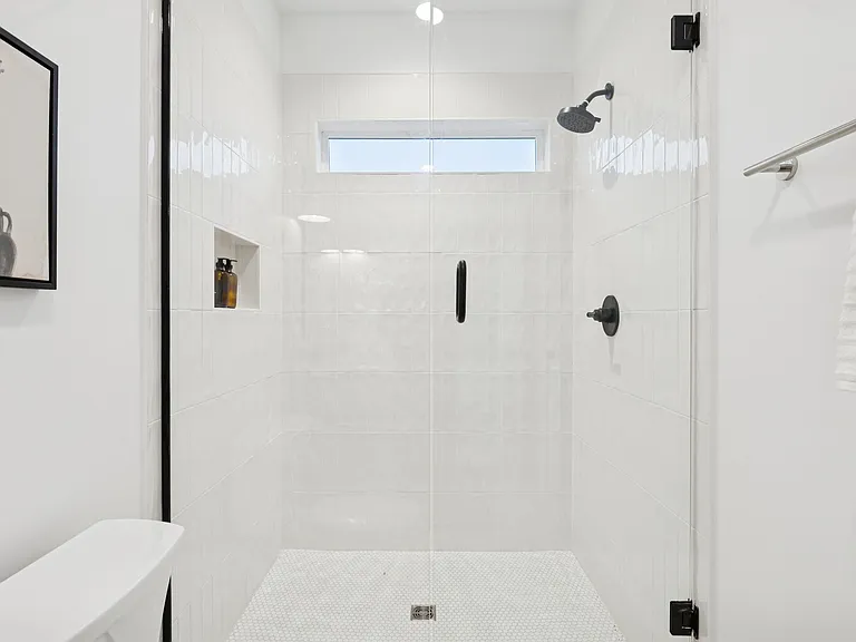 Full bathroom with standing shower, attached to bedrooms 3 and 4.