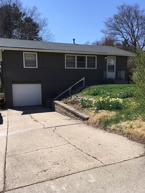 1 car garage with 2 car driveway! Beautiful tiered retaining wall with lots of flowers!