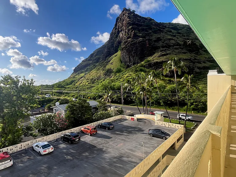 Look the other way to enjoy mountain views out the front door! Designated parking stall on this top parking level, conveniently located closest to the building.