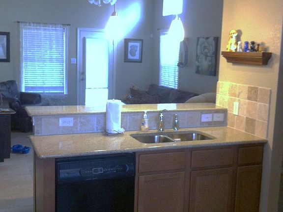 Kitchen with new granite and Travertine