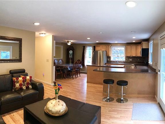 View of living, Kitchen and dining. Sliders to deck on the right of photo.