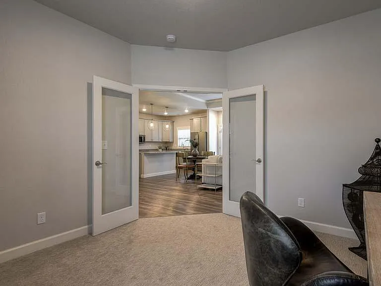 The Cardiff- 3rd Transitional Bedroom w/Glass Front French Doors That Look Out to the Kitchen, Dining and Great Room/Living Area.